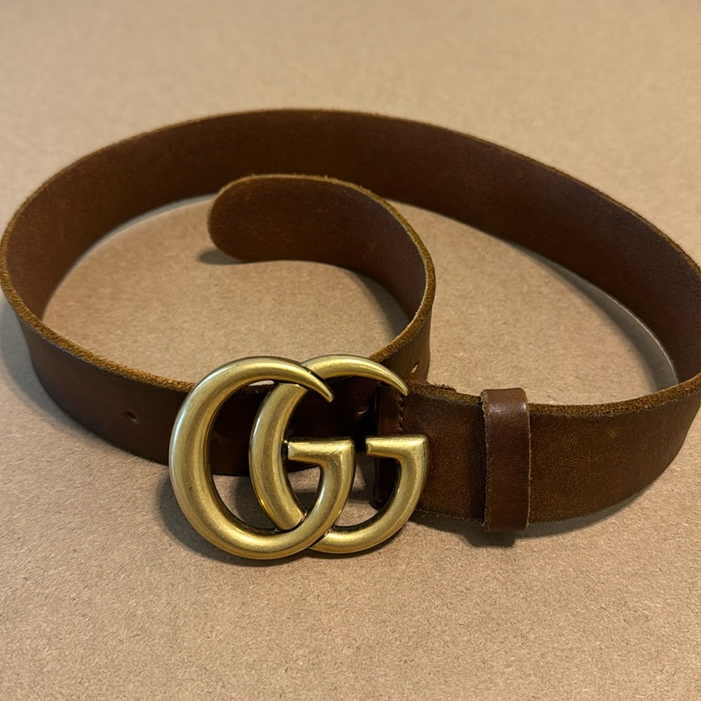 Tan and gold Gucci belt